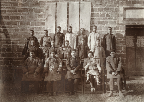 Group with banners and potted plants