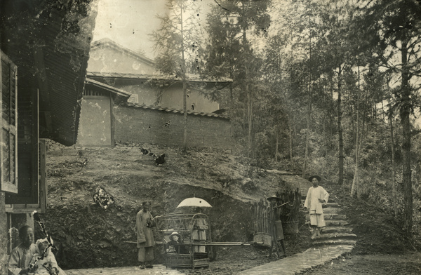 Foreign children with amahs, a peddlar and a sedan chair