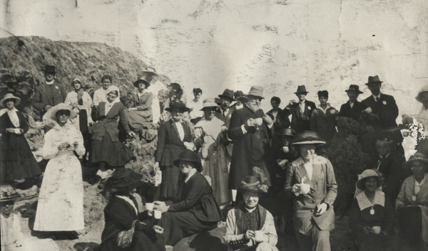 Group holding teacups