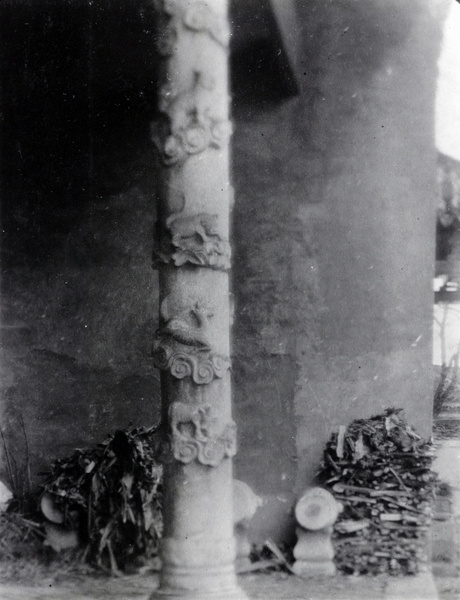 Carved stone pillars, and firewood