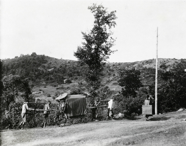 Four bearers and a sedan chair