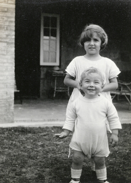 Children outside bungalow