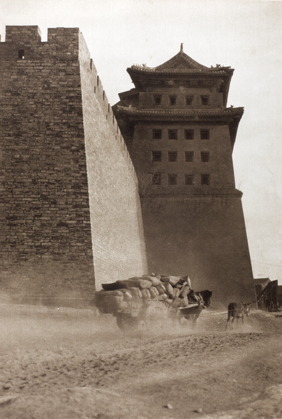 A cart laden with sacks passing Xizhimen, Beijing