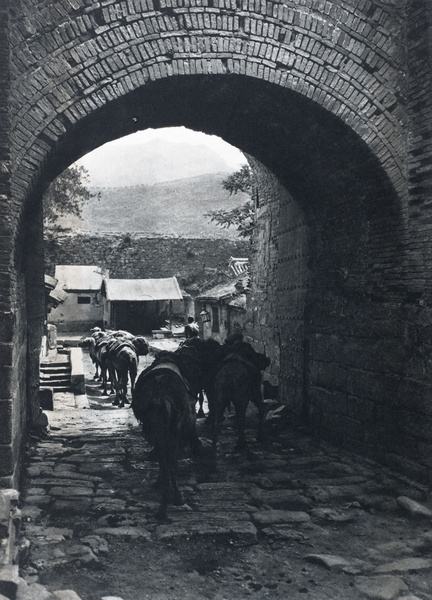 Camel train passing through a gateway at Juyongguan, near Beijing