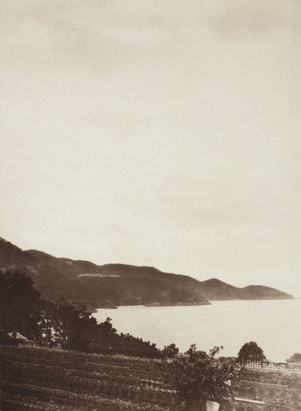 Repulse Bay viewed from a garden with many potted plants, Hong Kong