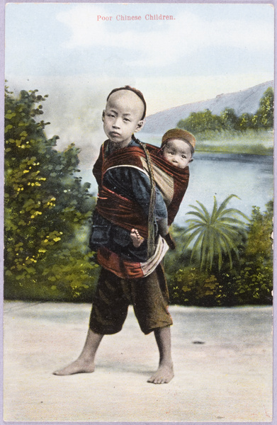 Child carrying a toddler on his back, South China