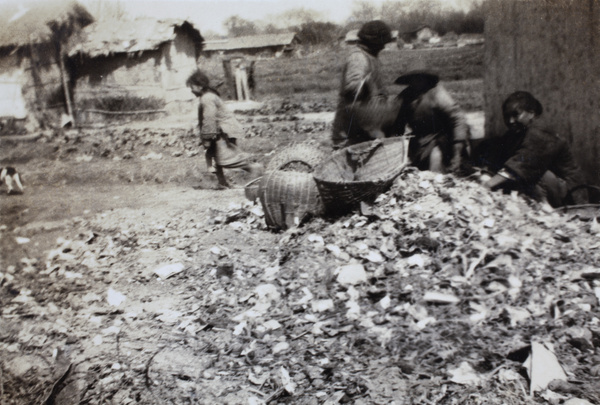 Women sifting through rubbish, Shanghai