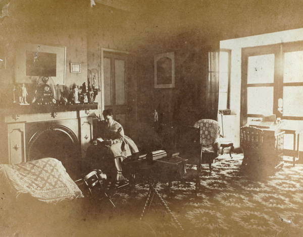 Thirza Bowra reading in a room, c.1870