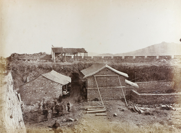 Shops inside the city wall, by a gate in the wall, Zhapu, c.1870