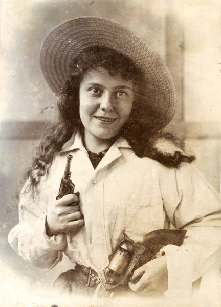 Portrait of a young woman in fancy dress (as Annie Oakley?)