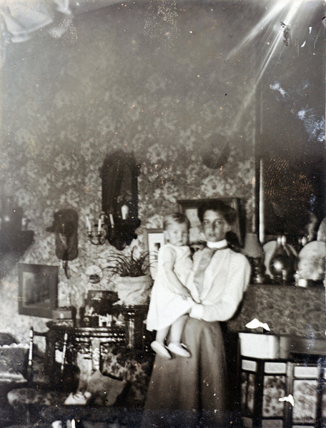 Maude Carrall and Jim, in sitting room at 'Hillside', Chefoo