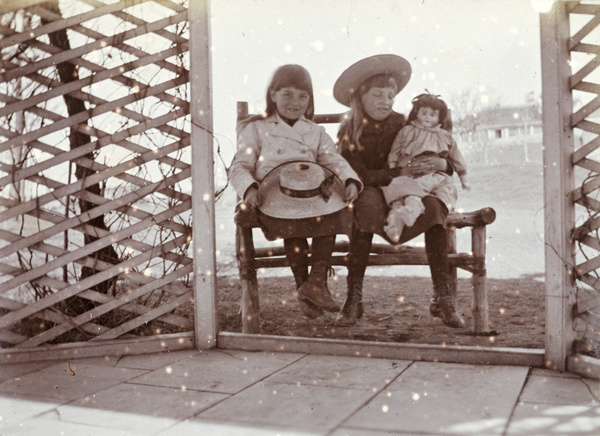 Phyllis and Gwen Carrall, with a doll