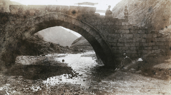 Bathing feet beside a bridge