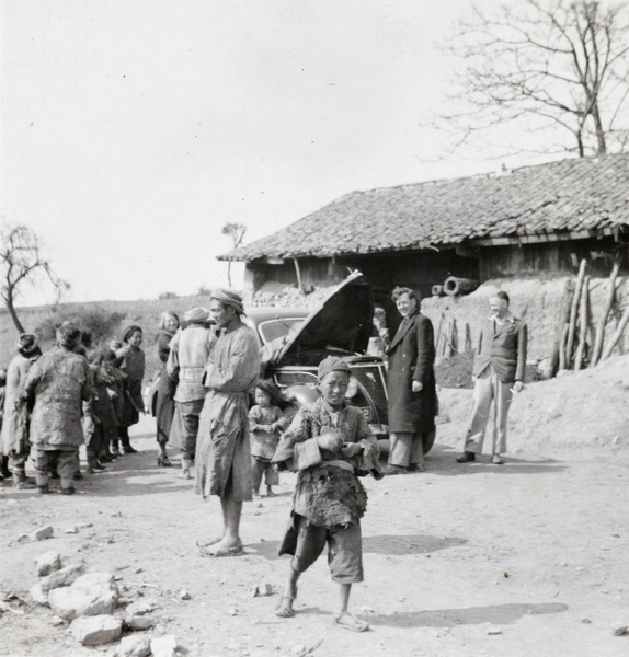 Filling up a car's radiator, between Chaotung and Weining