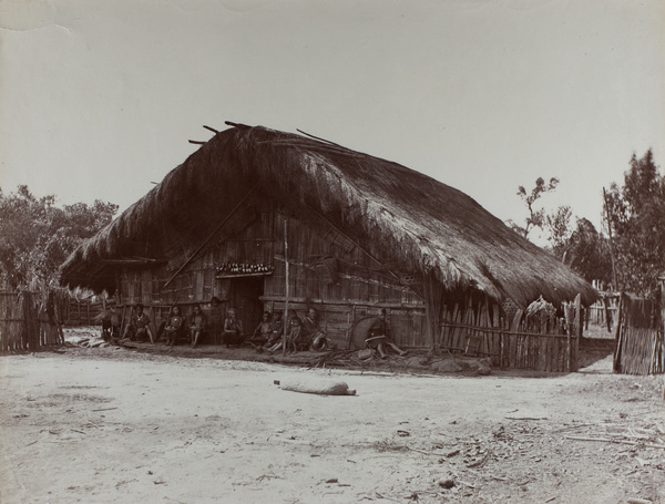 Aborigines sitting in front of house, Tsui-sia, Taiwan