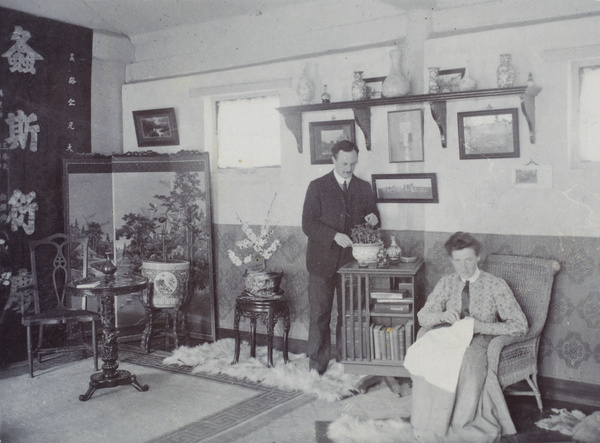 An unidentified couple in a living room