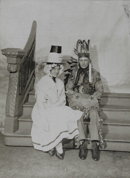 A man and a woman wearing fancy dress