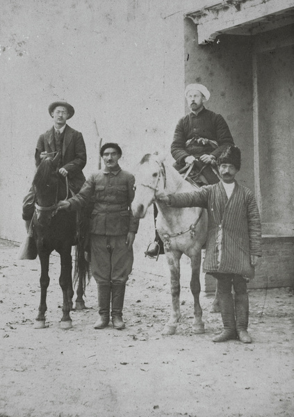 Harold Ivan Harding, with ponies and two men holding the reins, Kashgar