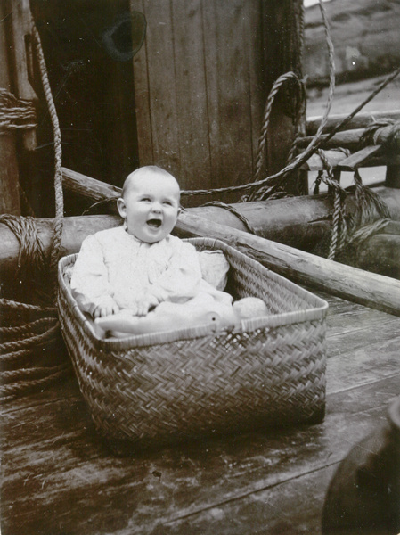 Bill Elliott on the family houseboat, Yangtze River, 1914