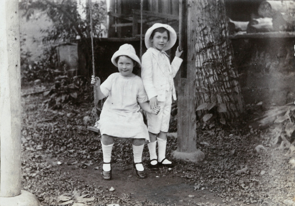 Dare and Evans Elliott under a walnut tree, Paoning, 1914