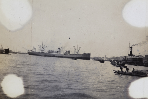 A Silver Line freighter turning in the Huangpu River, Shanghai