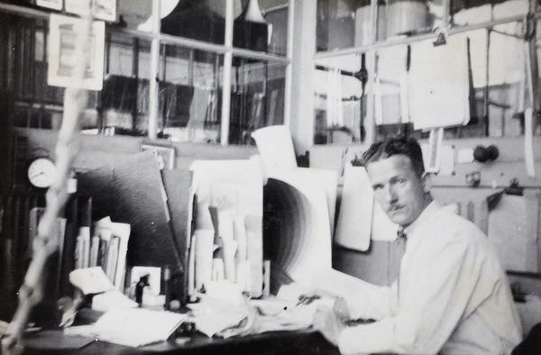 Mr Pulman in the Photographic Department Office, printing works, Shanghai