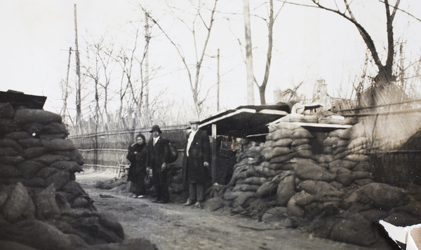 Group standing beside a sandbagged redoubt, Zhabei, Shanghai, 1932