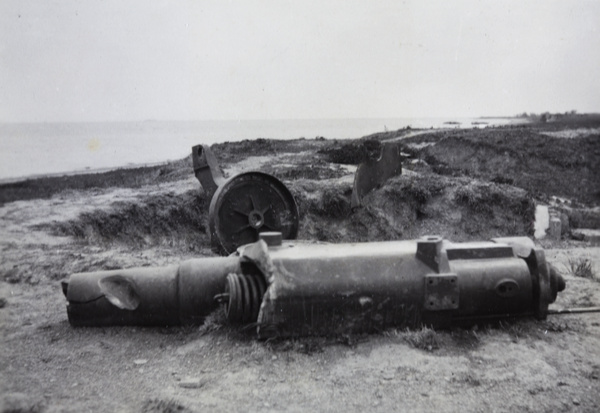 Damaged artillery beside the Huangpu River, near Shanghai