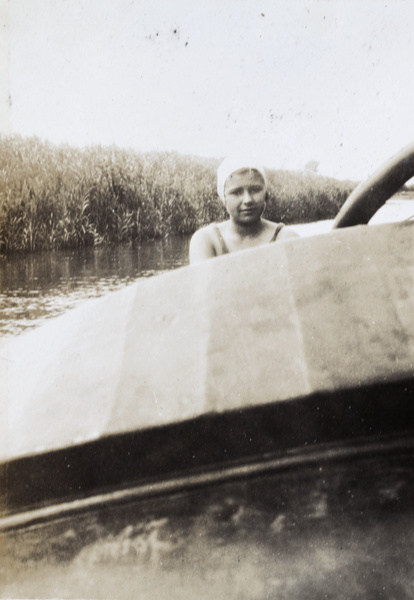 A young woman wearing bathing costume on a boat