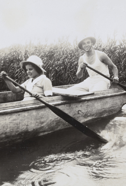 Gladys Ephgrave and E. P. Morphew rowing a boat