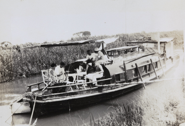 Reading and relaxing on a houseboat