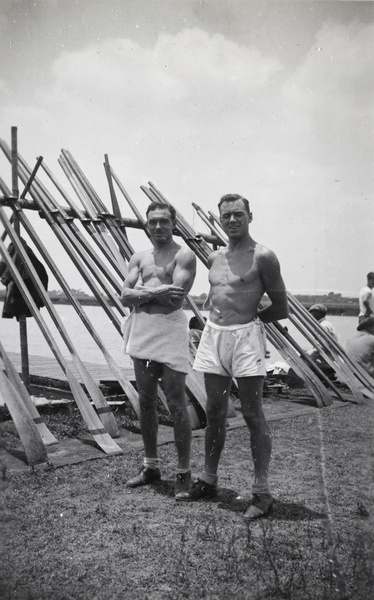 An unidentified man and E. P. Morphew, with a rack of rowing oars, Shanghai