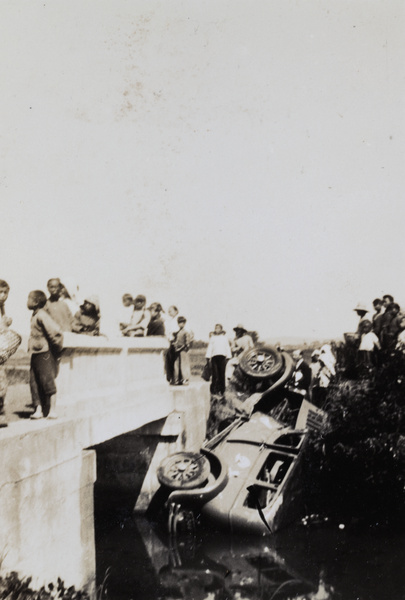 Onlookers by a car crash