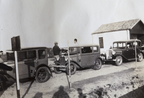 People and cars at a toll bridge