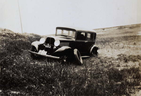 Accident aftermath - a car with a tyre removed