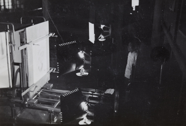 Chinese worker in photography room, lithographic printing factory, Shanghai