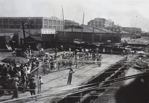Sailaway streamers to a ship leaving the Wayside Public Wharf (O.S.K. Wharf), Hongkou, Shanghai