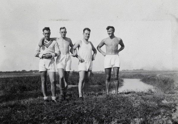 Shanghai Rowing Club members standing on an embankment