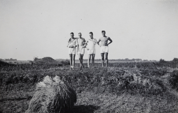 Shanghai Rowing Club members standing on an embankment