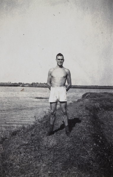 Shanghai Rowing Club member standing on a river embankment