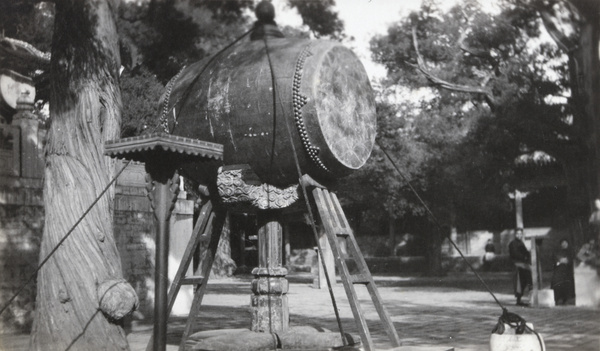 A large drum on a stand at a temple