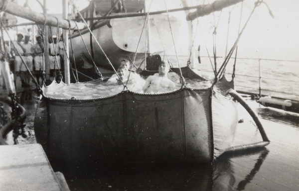 Royal Navy sailors in a canvas bath