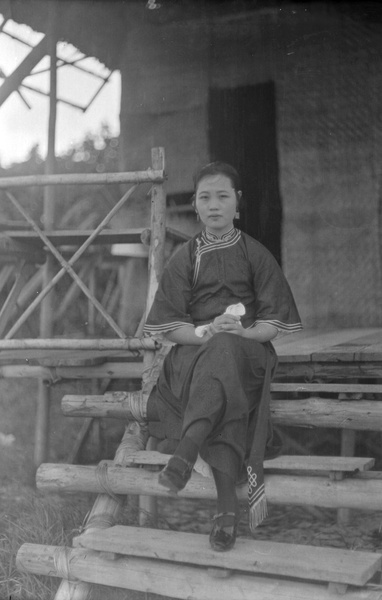 A woman sitting on steps