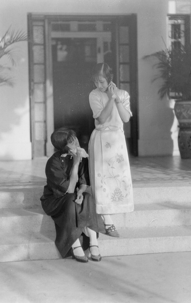 Two women by a doorway