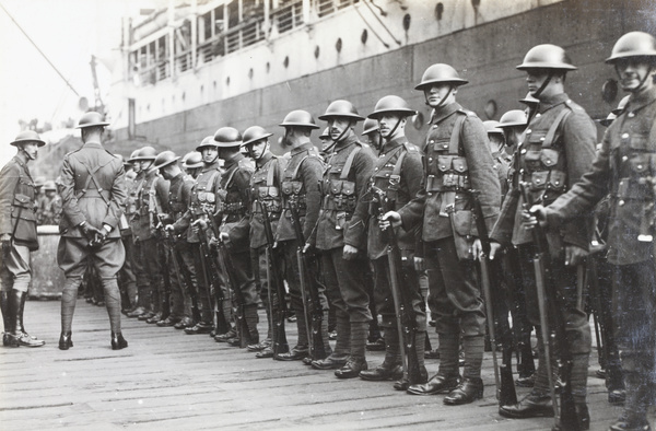 British troops (Shanghai Defence Force), lined up beside a ship