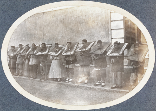 Chained convicts in cangues