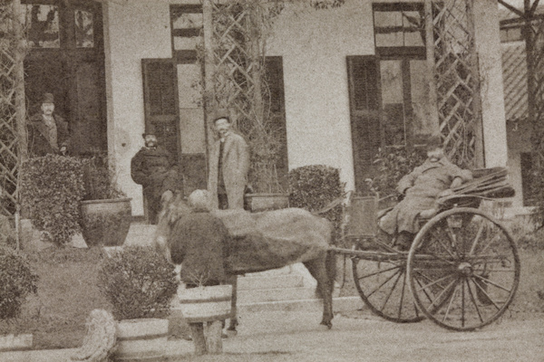 Men outside a house, Shanghai