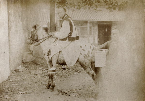 T'ai T'in-pui and pony outside the Custom House at Hoihow