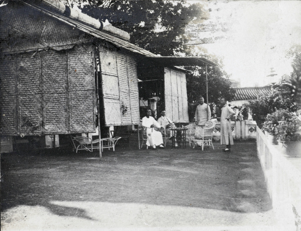 Taking tea on the terrace of the Assistants' Quarters, Lappa Island, near Macau