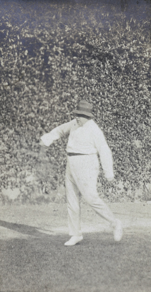 Hedgeland playing tennis in Hong Kong